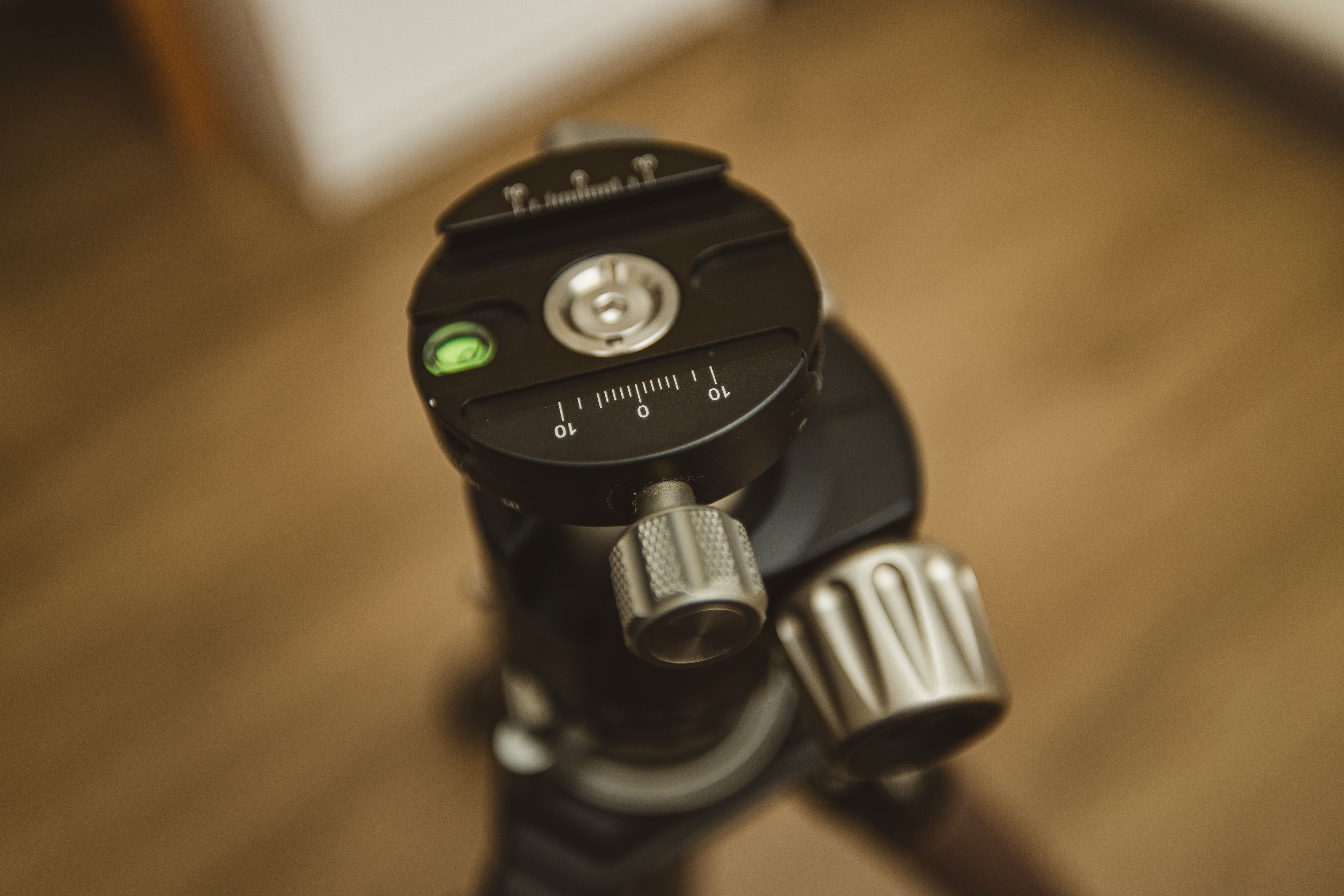 Detailed view of a black tripod head, essential equipment for photographers.