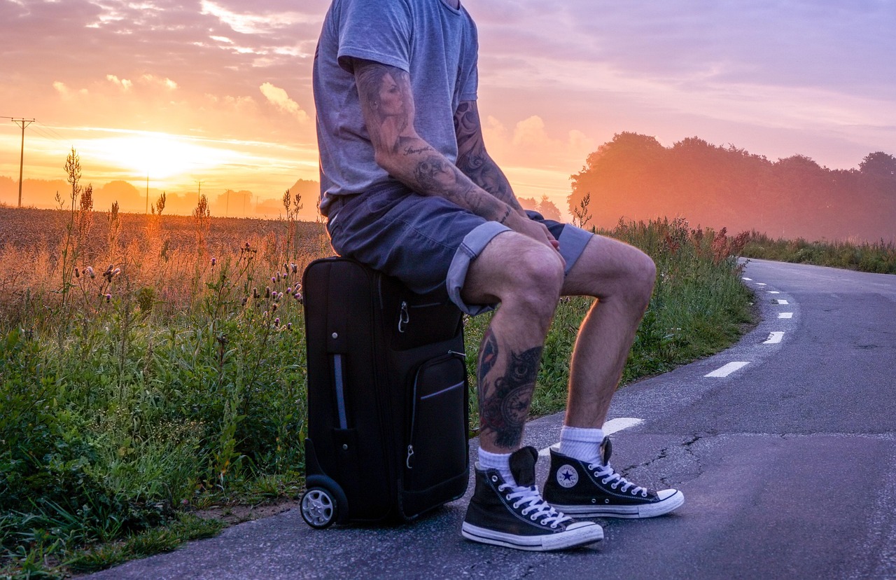 traveler, hiker, trip, hike, hitchhike, hitchhiker, man, tattooed, tattoos, tattoo, suitcase, shorts, converse, sitter,