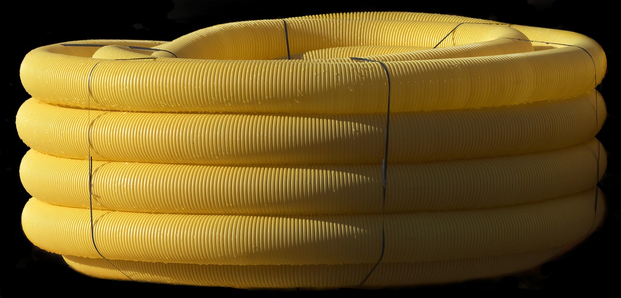drain pipe, flexible, wound up, role, pvc, drainage pipe, drainage, tube, wrapped, plastic, yellow, construction site, p