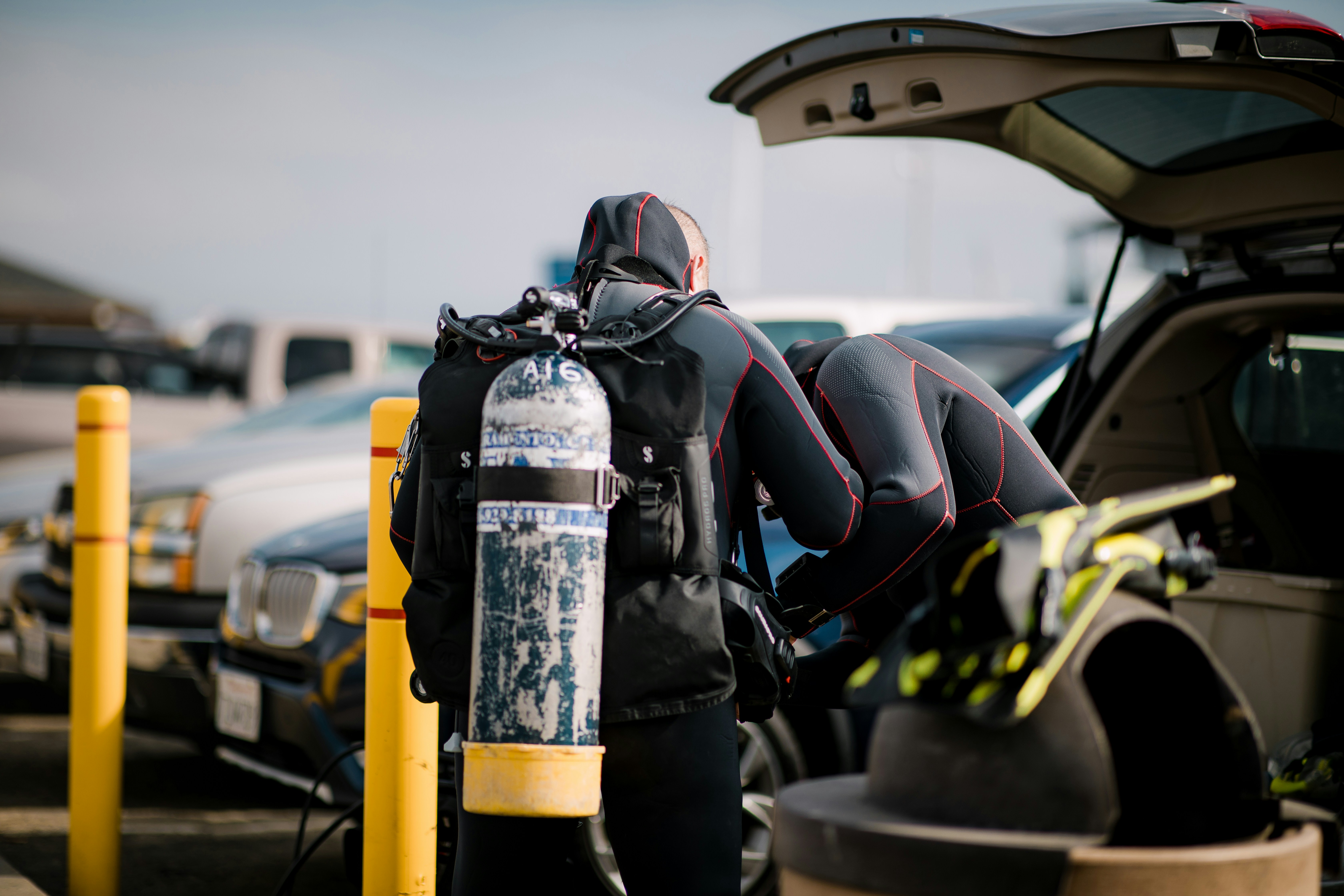 two scuba diver wearing scuba suit during daytime