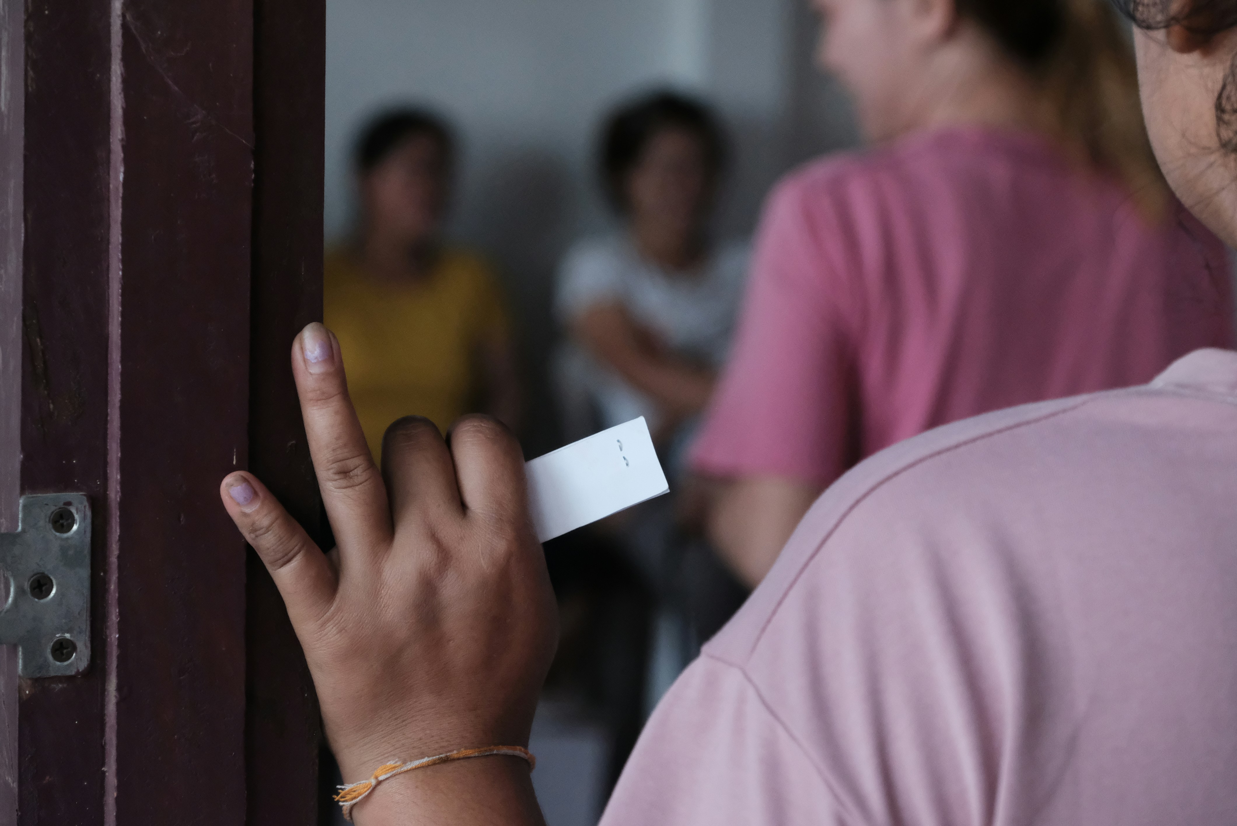 A person holding a white object in their hand