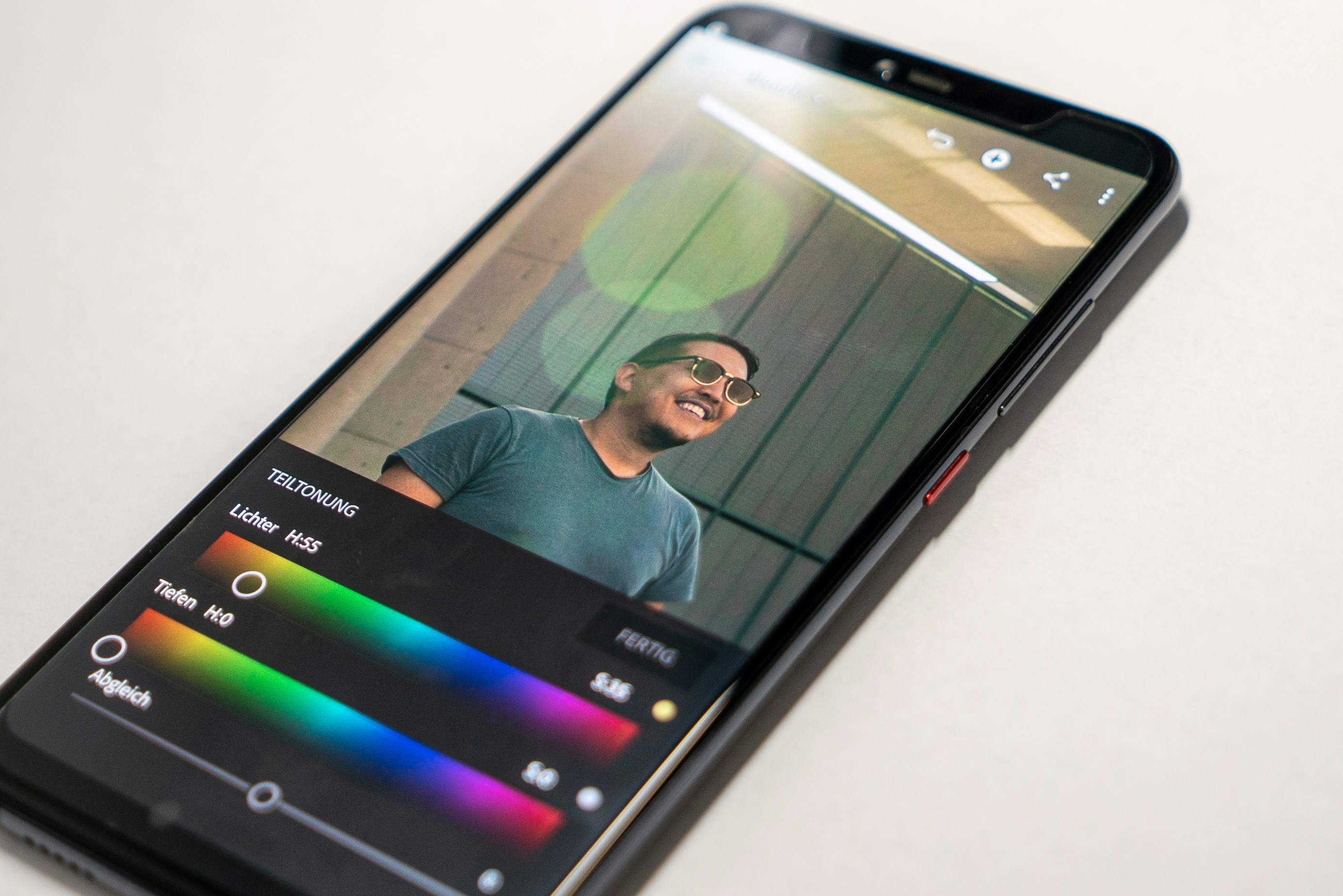 black Android smartphone on white surface